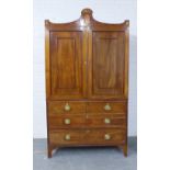 Early 19th century mahogany inlaid linen press, the shaped cornice with a central fan motif and