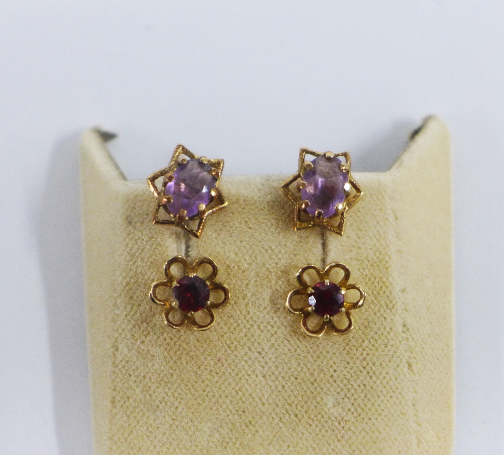 Two pairs of 9ct gold earrings, set with garnet and amethyst (2)