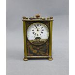 Early 20th century French brass and bronze cased timepiece, enamel dial with Roman numerals,10cm