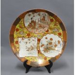 Late 19th / early 20th century Japanese earthenware charger, painted with figures and other motifs