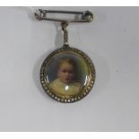 An early 20th century double portrait pendant brooch