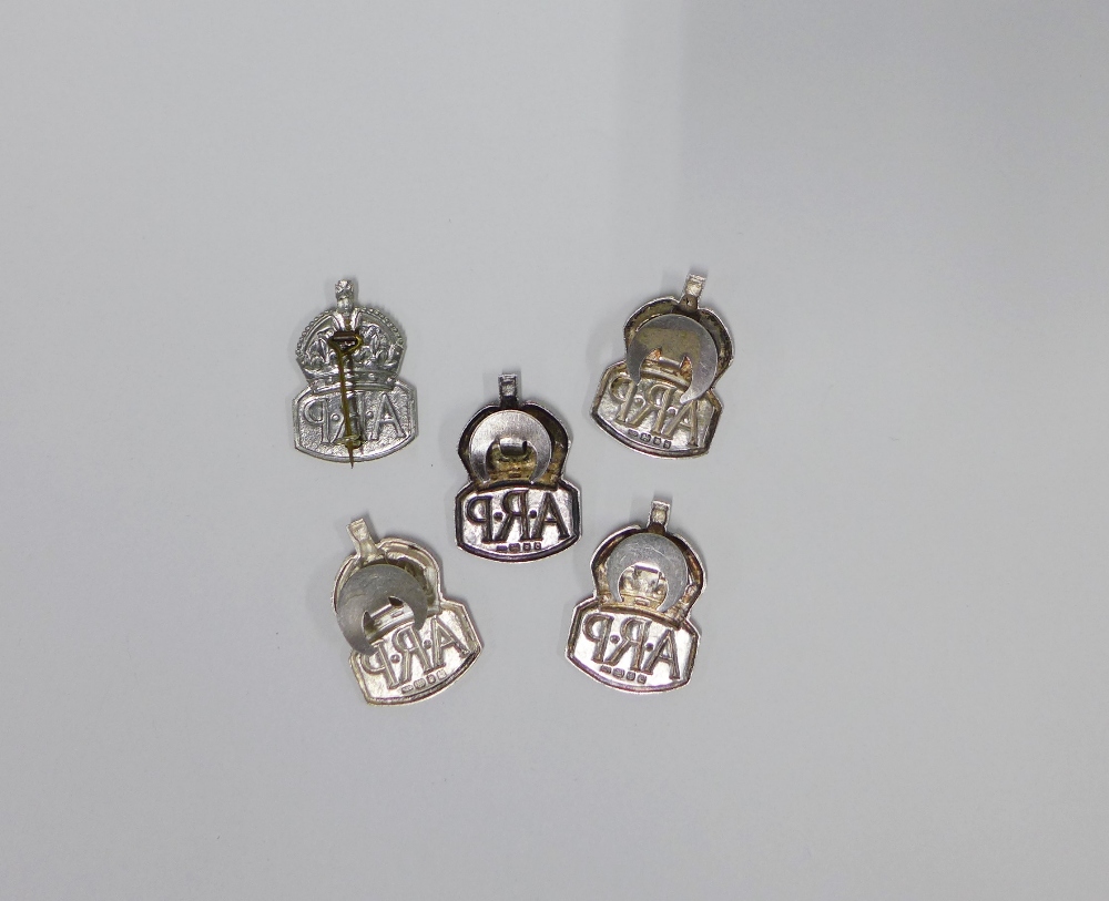 A group of five hallmarked silver ARP badges, (5) - Image 2 of 2