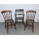 Three provincial wooden chairs to include and armchair and two side chairs, all with solid seats,