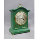 Junghans mantle clock in a green painted wooden case, silvered dial and Arabic numerals, on four