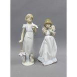 Two Lladro Collector's Society figures to include a girl with an umbrella, cat and bird, signed on