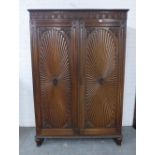 Mahogany wardrobe, with egg and dart cornice over a floral frieze and pair of cupboard doors with an