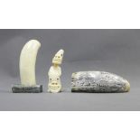 Two marine ivory carvings and a replica Scrimshaw, 15cm long (3)