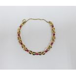 A modern 9ct gold gemset bracelet