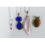 Four modern silver, shell and hardstone pendants, three on silver chains (4)