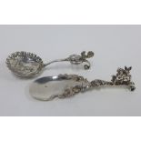 Two Continental silver caddy spoons, one with Chester silver import marks, longest 13cm (2)