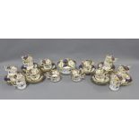 English porcelain tea set with two cake plates, slop bowl, twelve large cups, twelve smaller cups