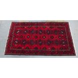 North East Persian Kordi Quchan rug, red filed with two rows of seven octagons, 288 x 158cm