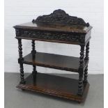 Oak three tier buffet with a carved ledgeback and drawer, on barley twist supports, 104 x 126 x 47cm