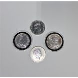 A group of four one ounce pure silver coins (4)