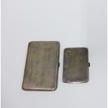 Two George V silver cigarette cases with Birmingham hallmarks for 1929 7 1930, largest 12cm (2)