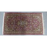 Persian wool rug, red field with allover foliate design, 126 x 72cm