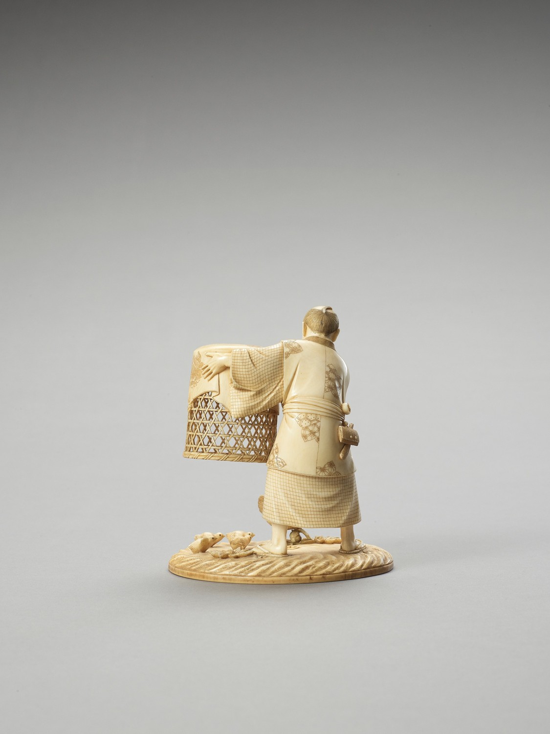 MUNEHIRO: AN IVORY OKIMONO OF A MAN WITH CHICKENS - Image 2 of 7