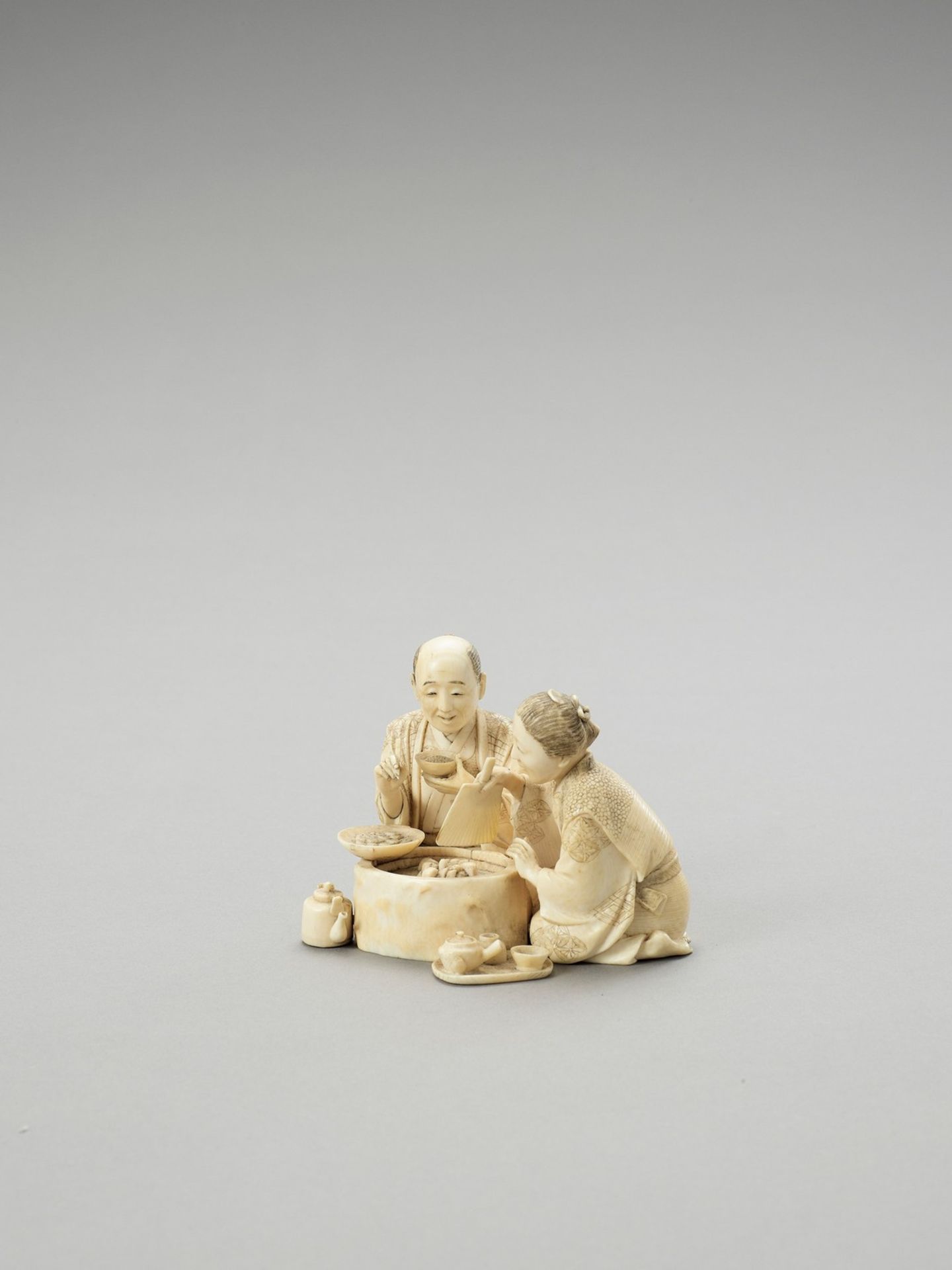 AN IVORY OKIMONO OF A COUPLE EATING - Image 2 of 5