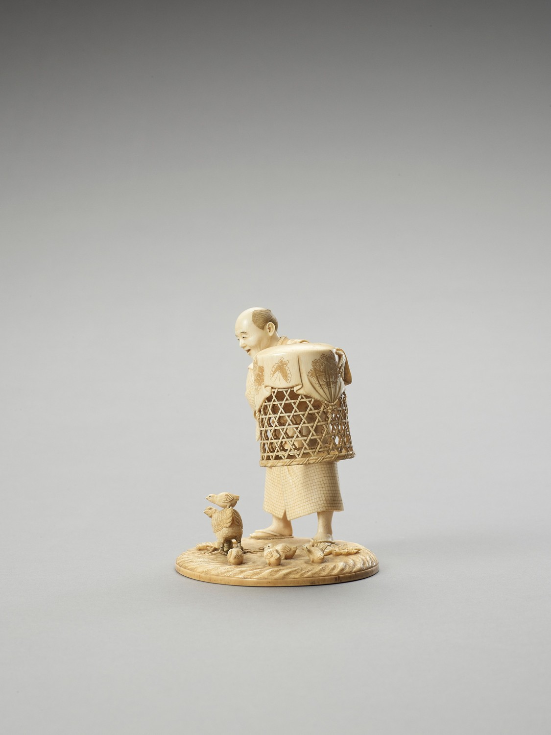 MUNEHIRO: AN IVORY OKIMONO OF A MAN WITH CHICKENS - Image 5 of 7