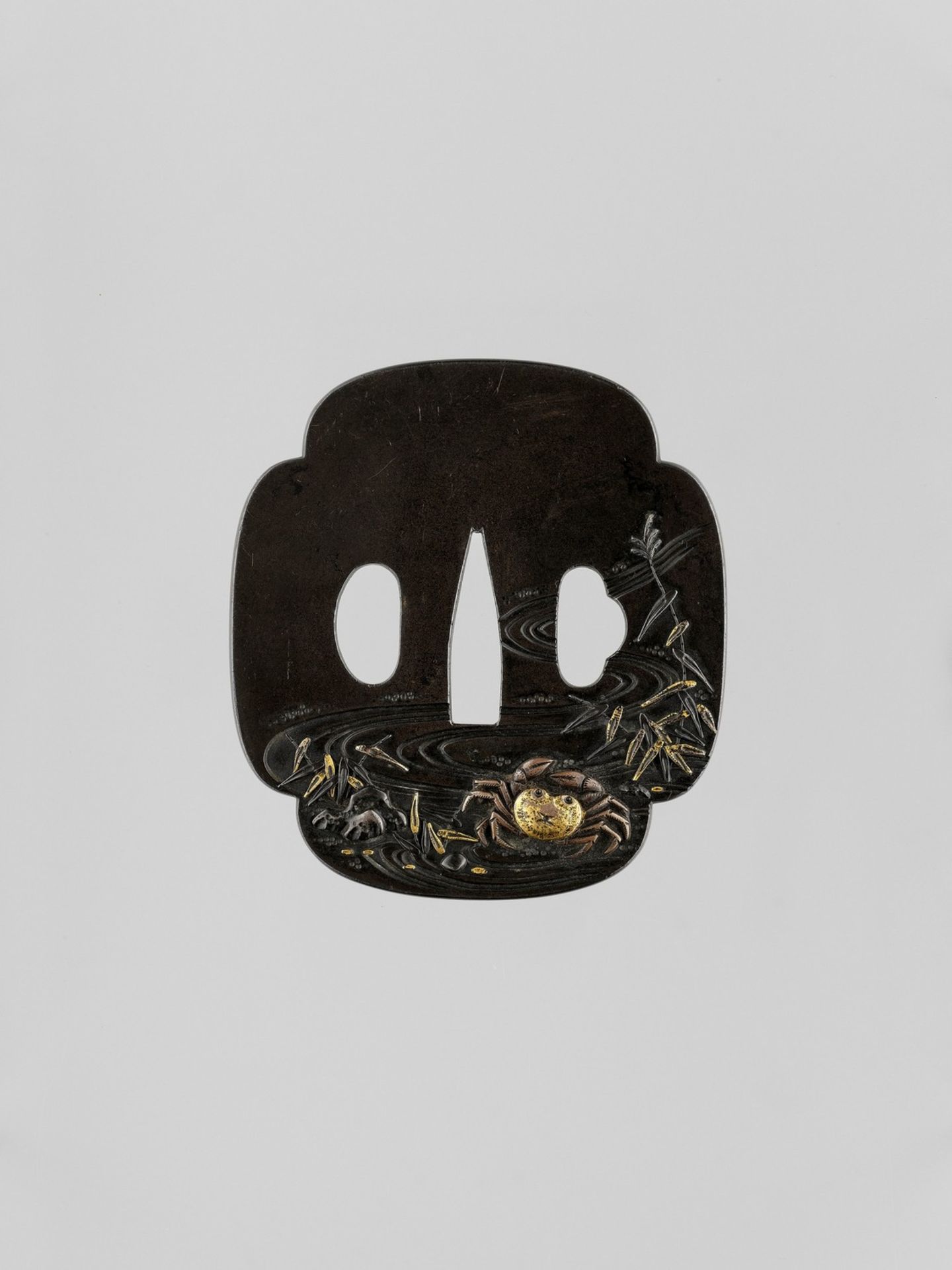 TOSHITSUGU: A GILT-INLAID SHIBUICHI TSUBA WITH A CRAB