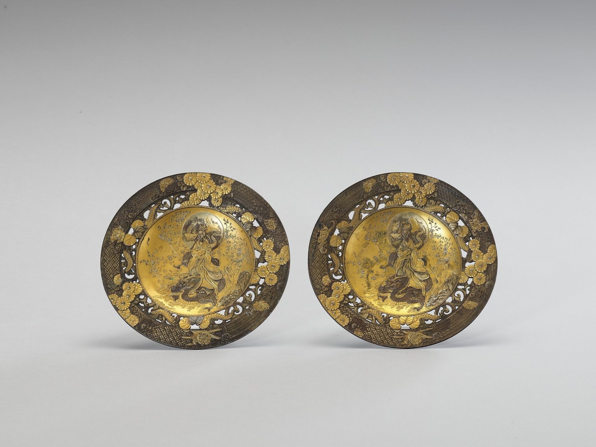 TWO IMPRESSIVE GILT METAL PLATES WITH BENTEN AND DRAGON