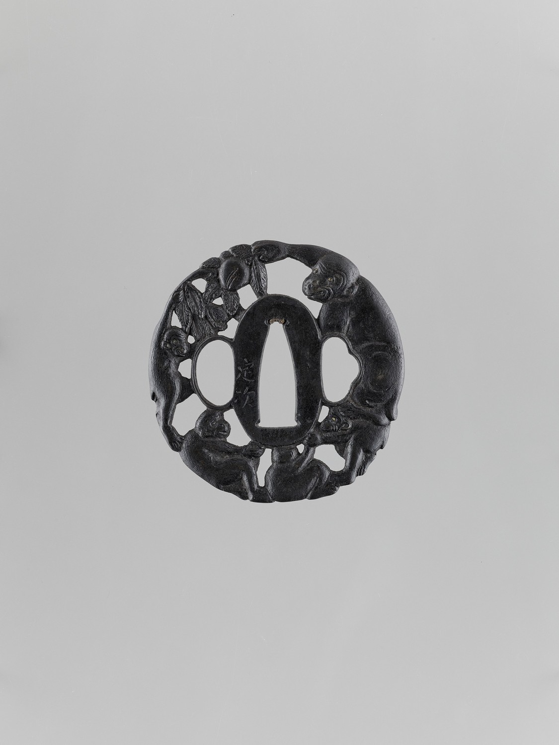 AN IRON TSUBA WITH MONKEYS