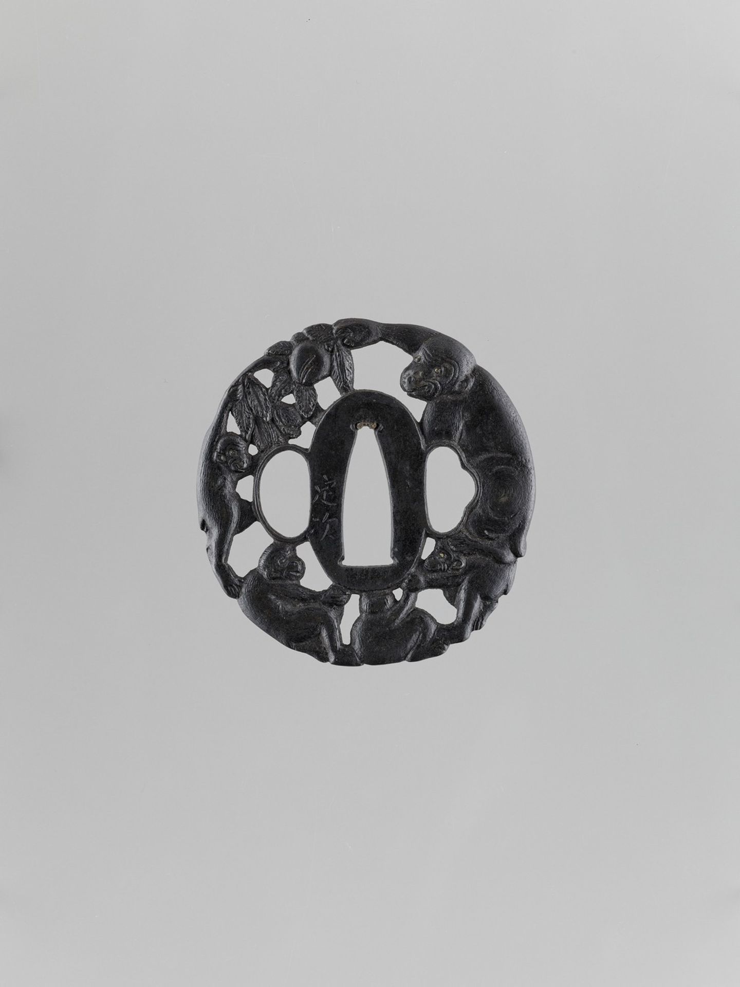 AN IRON TSUBA WITH MONKEYS