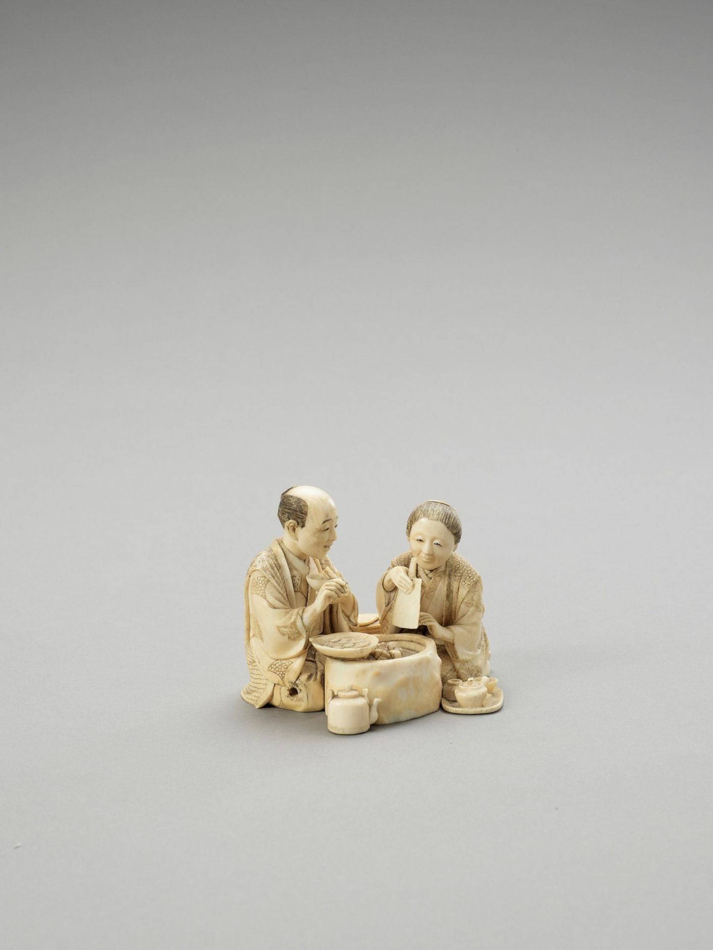 AN IVORY OKIMONO OF A COUPLE EATING - Image 3 of 5