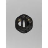 AN INLAID IRON TSUBA WITH FLYING GEESE