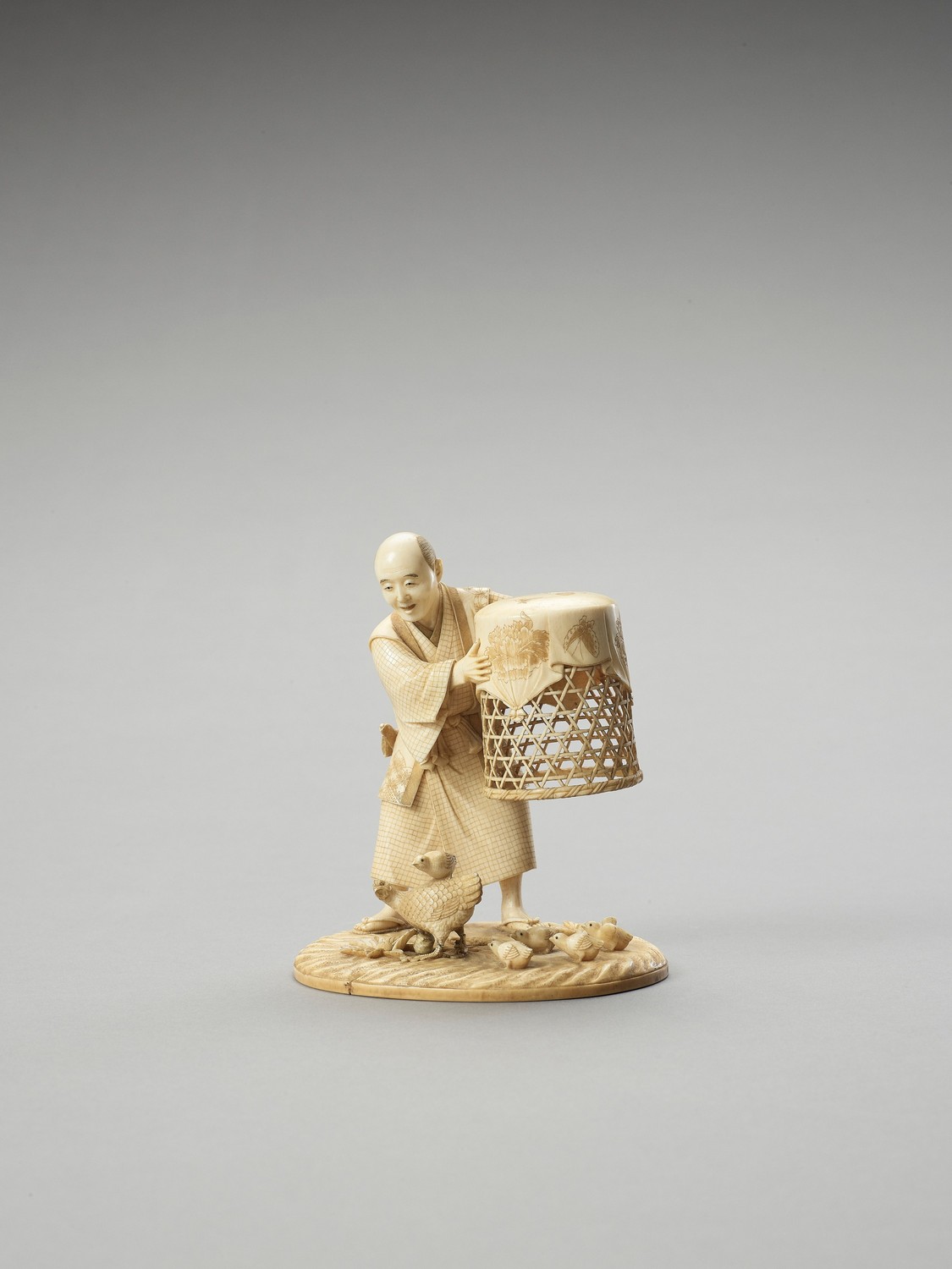 MUNEHIRO: AN IVORY OKIMONO OF A MAN WITH CHICKENS - Image 4 of 7