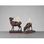 TOSHIYUKI: A PAIR OF WOOD AND IVORY OKIMONO WITH BOYS ON DEER