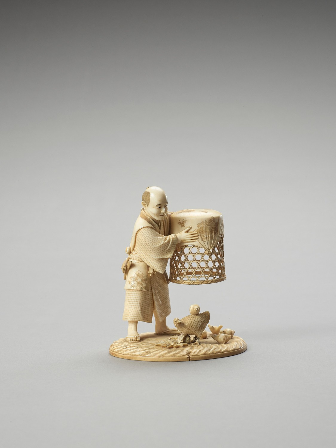 MUNEHIRO: AN IVORY OKIMONO OF A MAN WITH CHICKENS - Image 3 of 7