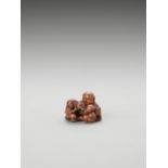 GYOKKOSAI: A WOOD NETSUKE OF HOTEI AND SHISHIMAI BOYS