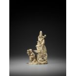 GYOKUSEN: AN IVORY OKIMONO OF KANNON SEATED ON A GIANT CARP WITH BOY