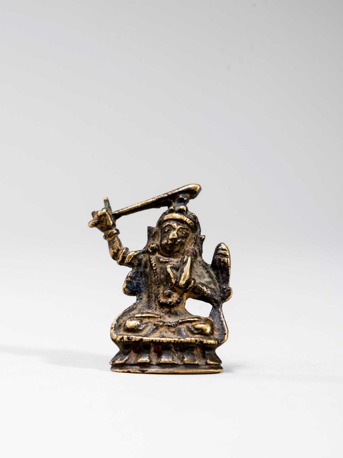 A TIBETAN MINIATURE BRONZE OF MANJUSHRI, 18TH-19TH CENTURY