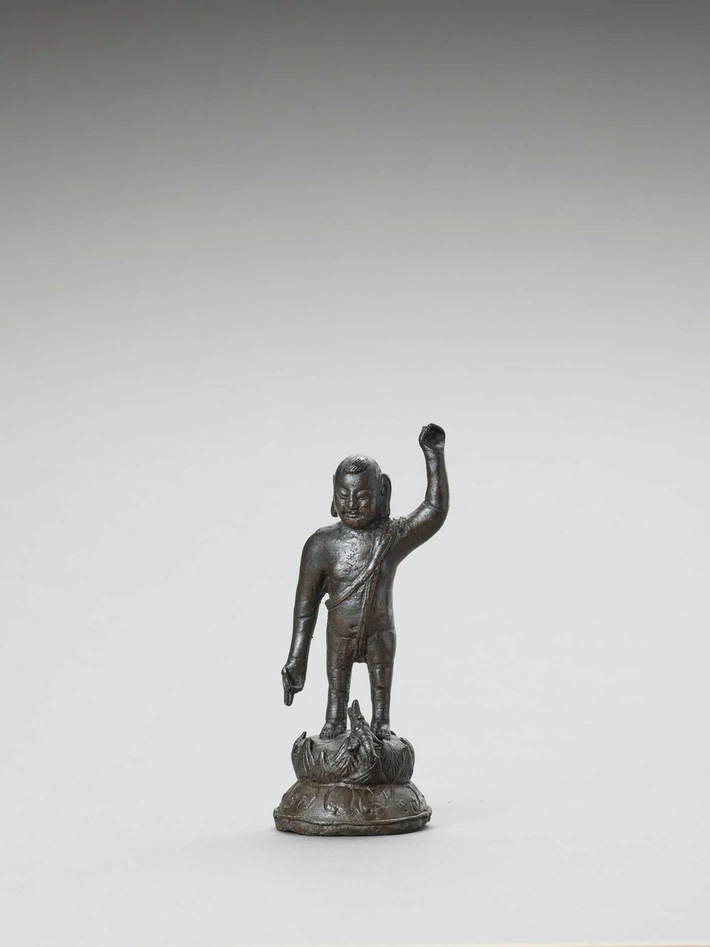 A BRONZE OF BUDDHA AS A CHILD, MING