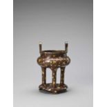 A GOLD-SPLASHED BRONZE TRIPOD CENSER WITH SIX-CHARACTER XUANDE MARK, QING