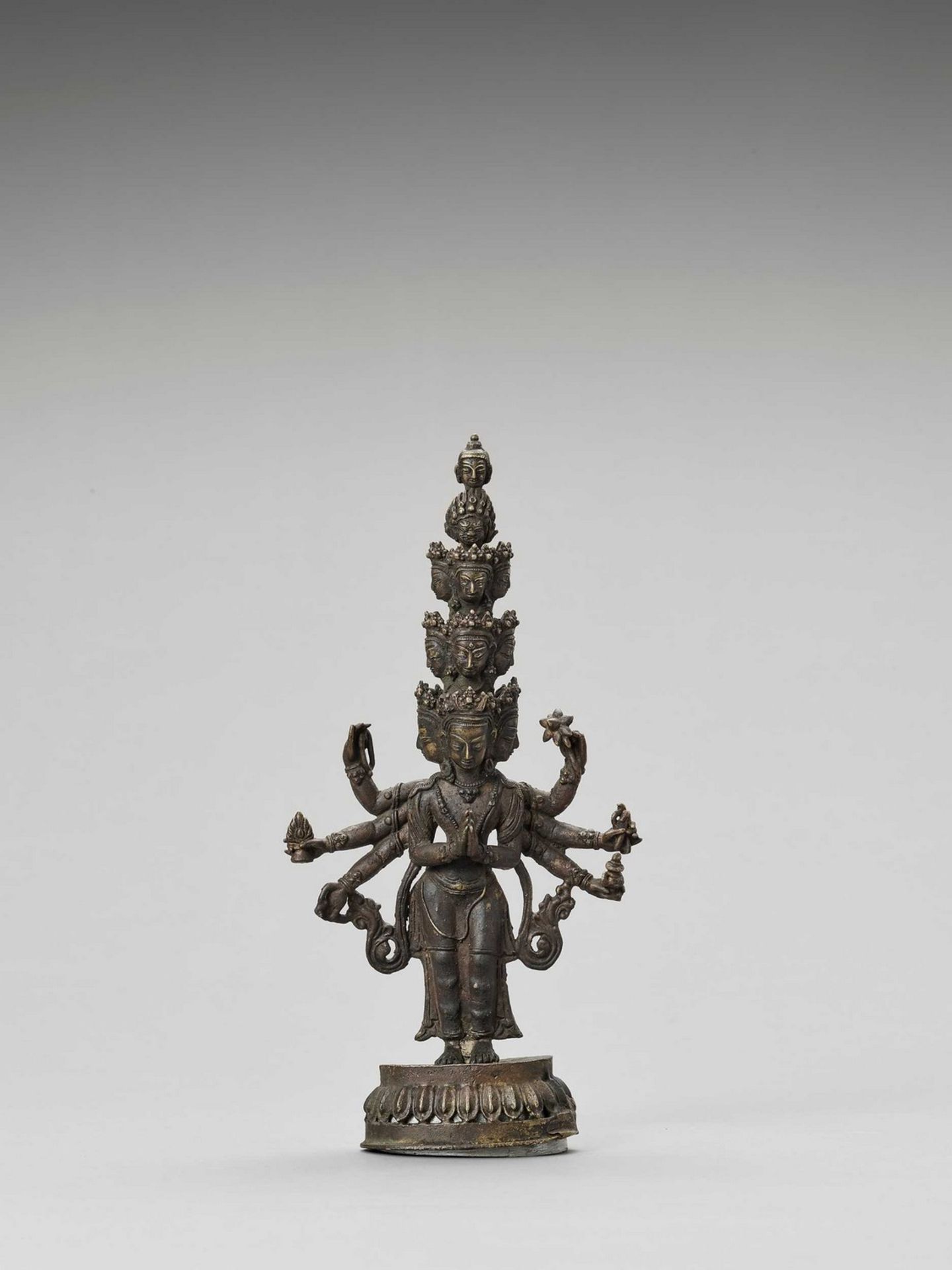 A SINO-TIBETAN BRONZE FIGURE OF EKADASHAMUKHA AVALOKITESVARA, QING