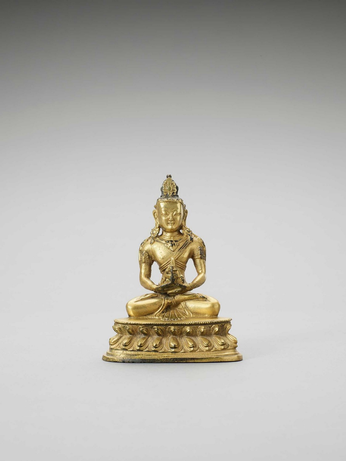 A FINE SINO-TIBETAN FIRE GILT BRONZE OF AMITAYUS