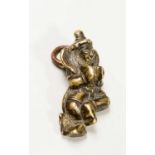 A TIBETAN MINIATURE BRONZE OF A DANCING BODHISATTVA