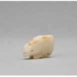 AN ARCHAISTIC WHITE JADE MYTHICAL BEAST HEAD, QING