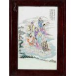 A PORCELAIN WALL PLAQUE WITH THE EIGHT IMMORTALS