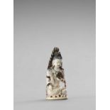 AN IVORY FIGURE OF GUANYIN, LATE QING