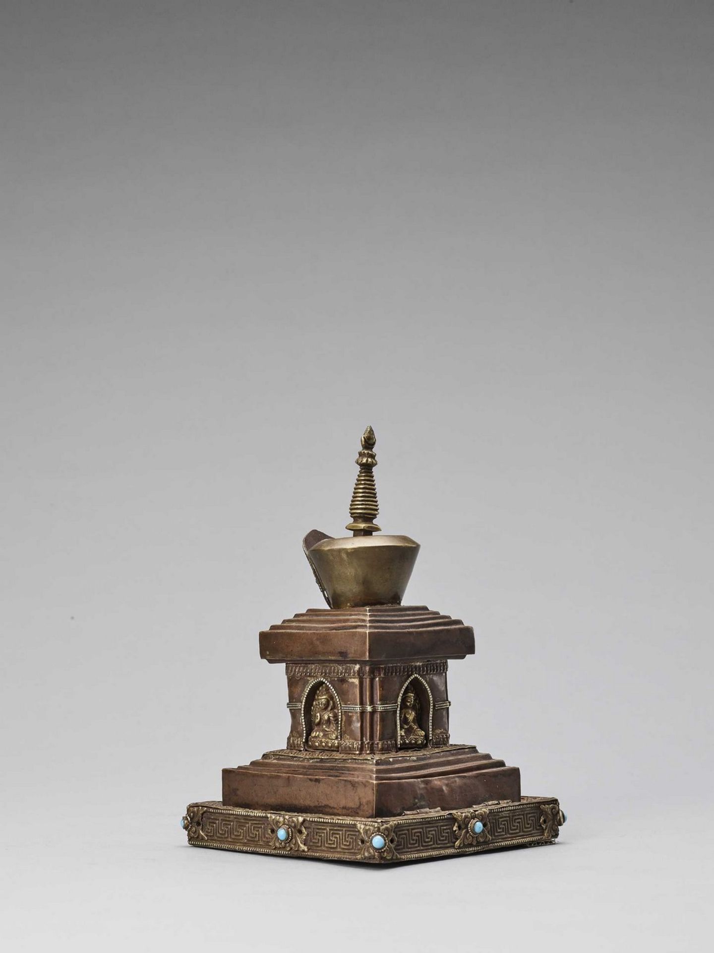 A TIBETAN COPPER REPOUSSÉ STUPA WITH TURQUOISES, 19TH CENTURY - Image 2 of 6