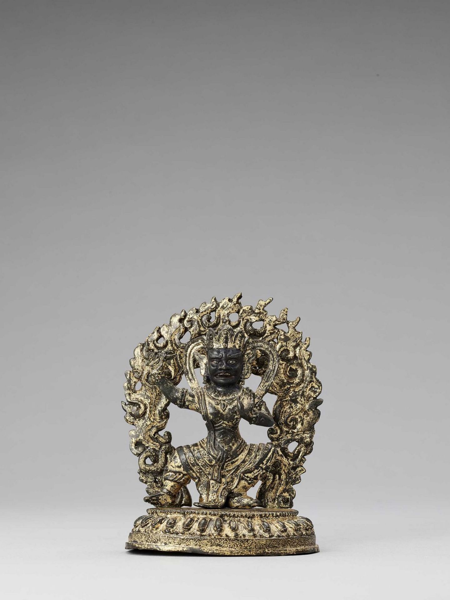 A TIBETAN LACQUER-GILT BRONZE FIGURE OF VAJRAPANI