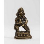 A TIBETAN MINIATURE BRONZE OF KUBERA, 18TH-19TH CENTURY