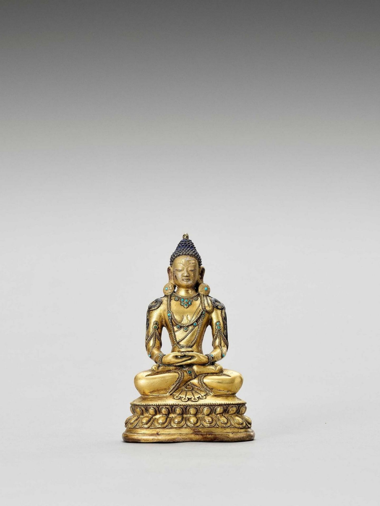 A SINO-TIBETAN GILT BRONZE FIGURE OF BUDDHA, QING