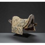 A WOOD SADDLE WITH GILT IRON FITTINGS AND SILK BROCADE COVER, 17TH-18TH CENTURY