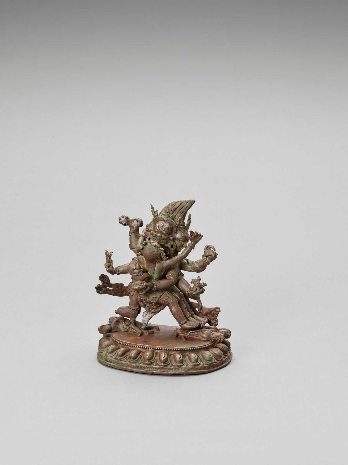 A HEAVY SINO-TIBETAN BRONZE FIGURE OF MAHAKALA AND CONSORT, QING