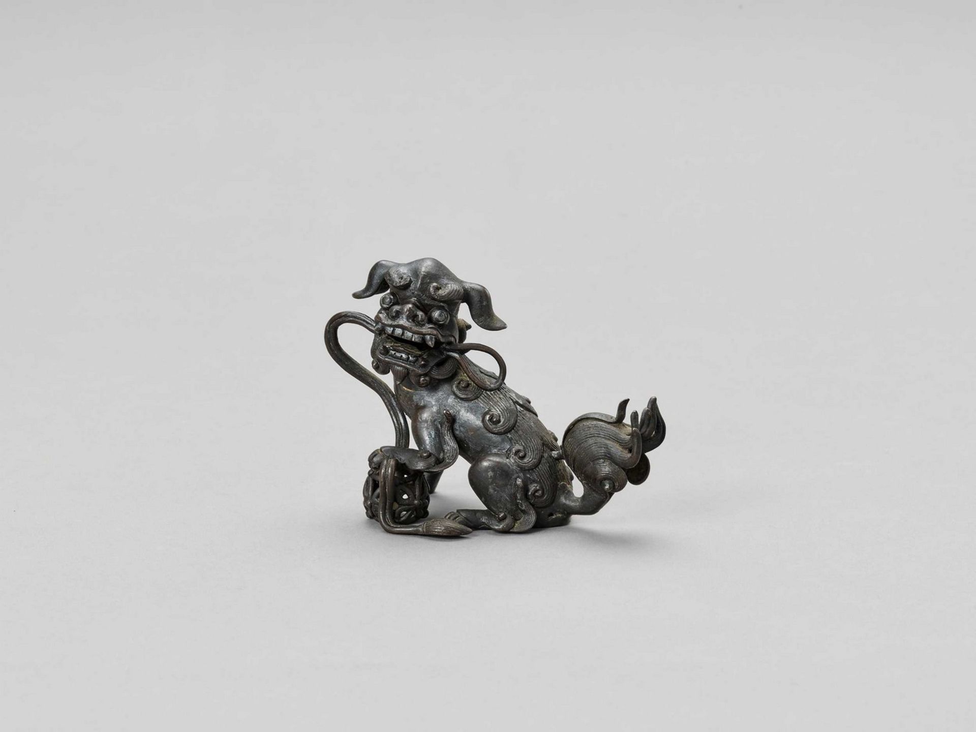 A BRONZE ‘BUDDHIST LION’ CENSER, 17TH CENTURY